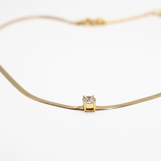 Collana fettuccia dorata con punto luce
