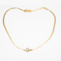 Collana fettuccia dorata con punto luce